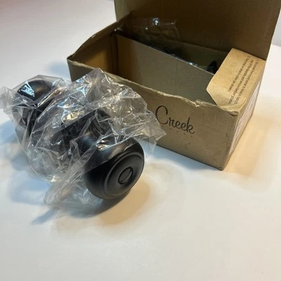 Perilla de puerta colonial redonda de bronce toscano Copper Creek: estilo baño - paquete de 1 Foto 1 de 4