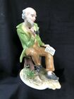 antique german porcelain figurine . Old man with pipe and book. Marked Bottom