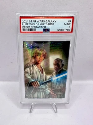 2024 Star Wars Galaxy #5 Luke Wields Light Saber PRISM Refractor /75 PSA 9 - Image 1 of 2