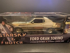 FORD GRAN TORINO STARSKY & HUTCH GOLD CHROME PLATED VERSION George Barris 1:18 - Bild 1 von 2