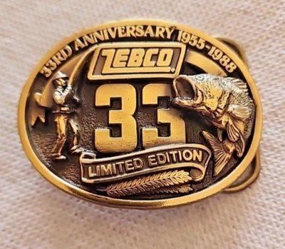 VINTAGE 1988 ZEBCO 33RD ANNIVERSARY BASS FISHING REEL BELT BUCKLE! USA! NEW  - Image 1 of 4