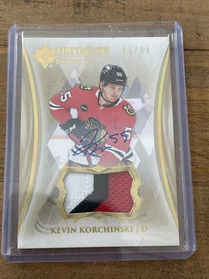 2023-24 ULTIMATE COLLECTION KEVIN KORCHINSKI /99 RPA Auto 3 Color - Image 1 of 2