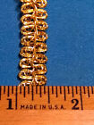 New old stock spools of Treasured Trims Gold Metallic Chinese Braid ribbon