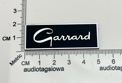 Logotipo de insignia Garrard hecho a medida inciso negro y plateado acrílico autoadhesivo Foto 1 de 4