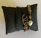 Handcrafted Sogoli wrap bracelet w/ black leather, gold chain and embellishments