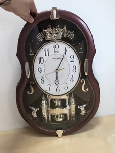 Small World Rhythm Violin Clock 4MH829 Plays Melodies Lights Spins Rocks - Picture 1 of 15