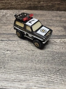 Matchbox Mega Blasters Cap Auto Chevy K5 Blazer Sheriff Patrol Police schwarz  - Bild 1 von 2
