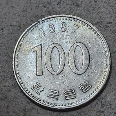 SOUTH KOREA 🇰🇷 100 WON COIN 1987 - Image 1 of 2