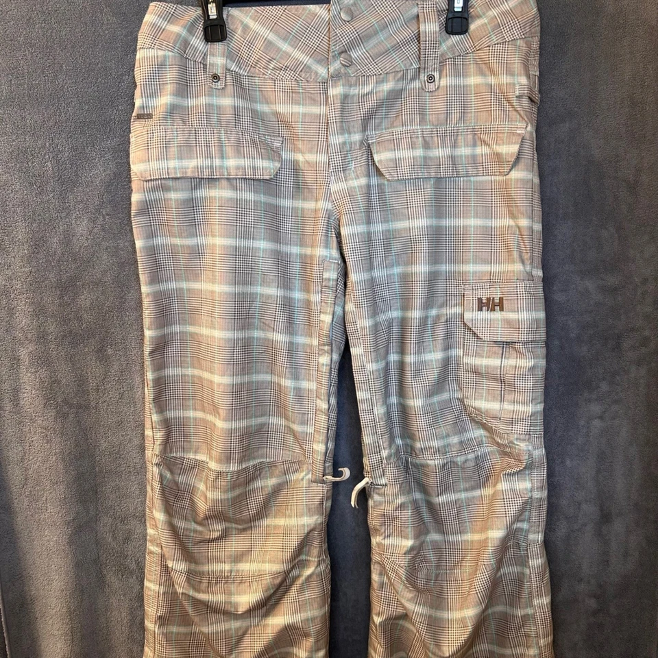 Pantalones de esquí snowboard Helly Hansen medianos 34x32 a cuadros marrón tostado aislados Foto 1 de 4