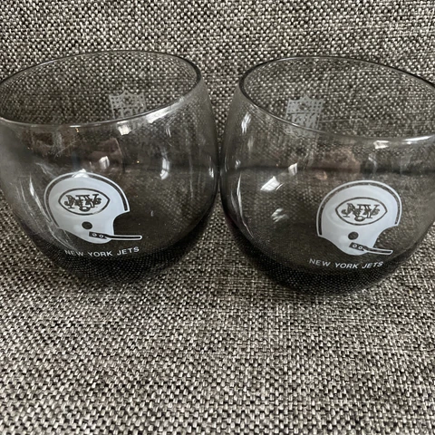 A Pair Of Vintage Mid Century NFL Roly Poly New York Jets Glasses Cover