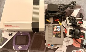 Nintendo Entertainment System (NES) With Controllers and Super Mario Bros