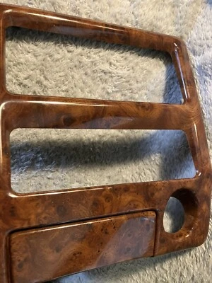 Bisel y cenicero 94-97 Chrysler LHS Woodgrain estéreo/clima/encendedor 4595498 Foto 1 de 4