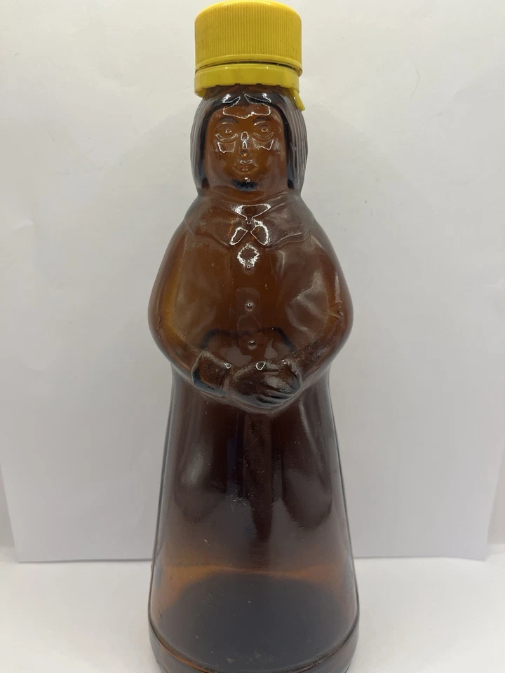 MRS. BUTTERWORTH'S 8.5" AMBER GLASS EMPTY SYRUP BOTTLE WITH PLASTIC YELLOW CAP - Image 1 of 4