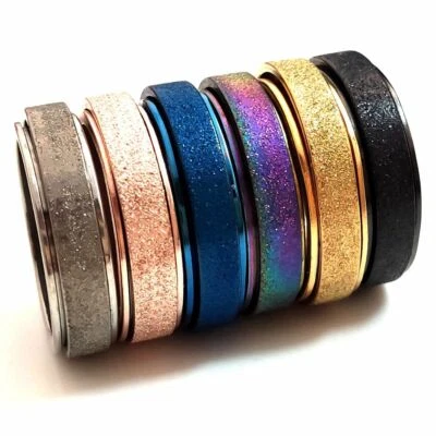 Anillo giratorio de acero inoxidable con acabado de arena mezcla de colores 36 piezas joyería anti ansiedad Foto 1 de 4