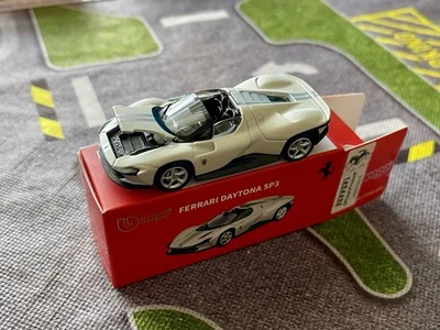 Bburago 1/64 Pearl White FERRARI DAYTONA SP3. WITH OPENING HOOD AND RUBBER TIRES - Image 1 of 3