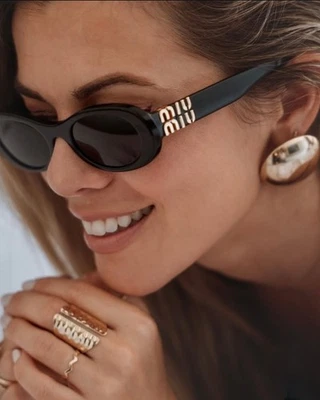 Miu Miu MU06ZS 1AB5S0 Oval Sunglasses in Black /Gray Lens 100% UV - Image 1 of 4