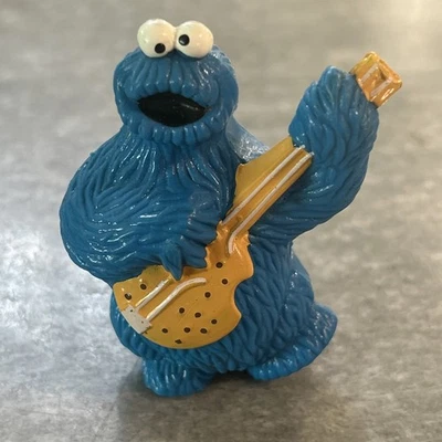 Figura de juguete Cookie Monster tocando guitarra Sesame Street Muppets Inc PVC 1982 DE COLECCIÓN Foto 1 de 4