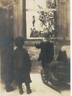 SA1629 POSTCARD  BOY ON SLEDGE LOOKING AT TOYS DECORATED XMAS TREE IN WINDOW
