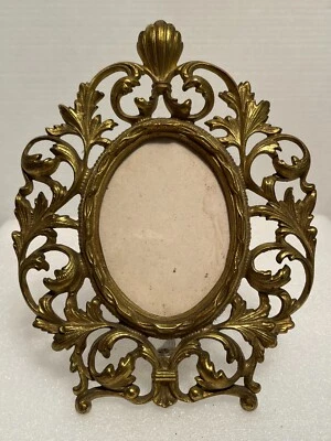 Caballete antiguo vintage de hierro fundido de latón dorado arte ornamentado ovalado marco de fotos Foto 1 de 4