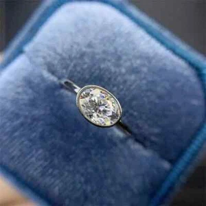 2 Ct Oval Simulated East West Bezel Set Engagement Ring In 14K White Gold Plated - Picture 1 of 6
