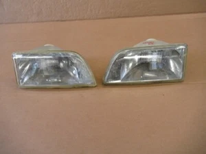 CITREON AX FRONT HEAD LIGHTS ( a pair damaged fixing lugs ) - Picture 1 of 13