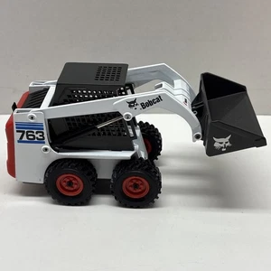 Minicargadora Bobcat 763 azul juguete de metal modelo 1:25 - Imagen 1 de 8