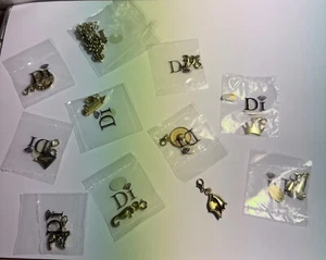 DIAMONDS INTERNATIONAL CHARM BRAZALETE CON 10 DIJES Set #3 - Imagen 1 de 7