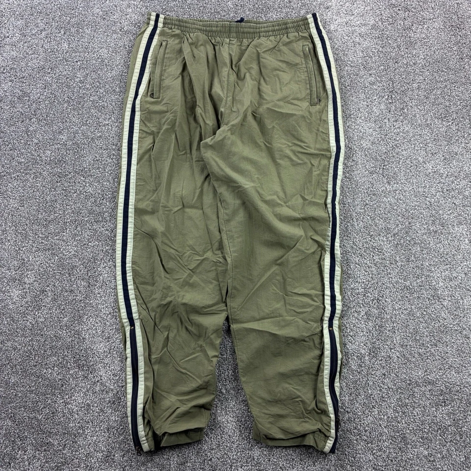 Pantalones deportivos vintage con borde plateado para hombre M verde oliva forrados con cremallera al tobillo a rayas elegantes Foto 1 de 4