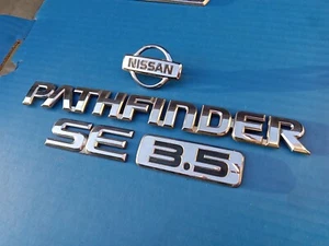 NISSAN PATHFINDER SE 3.5 99-01 CHROME EMBLEM WITH LOGO SET OEM USED  - Picture 1 of 4