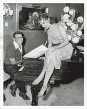 1955 Press Photo Connie Russell, singer, sits on piano while rehearsing.