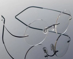 Monturas de gafas ópticas flexibles redondas sin montura Agstum titanio puro Rx - Imagen 1 de 29