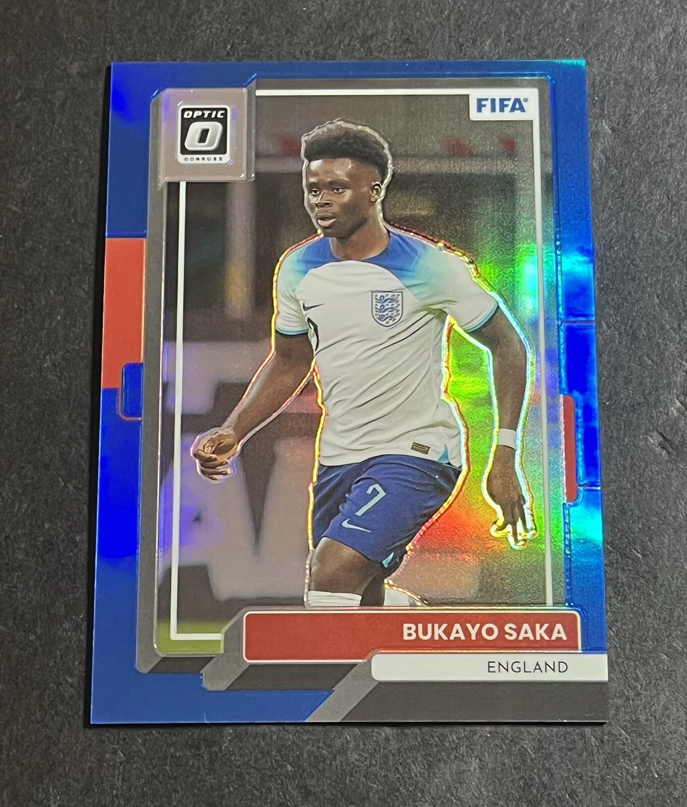2022-23 Panini Donruss Optic FIFA Bukayo Saka #26 Blue Prizm /99 - England
