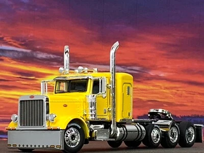 1/64 DCP YELLOW PETERBILT 389 TRI AXLE W/ 36" SLEEPER - Image 1 of 4