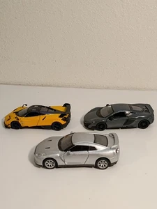 Kinsmart Lot Of 3 Cars 1/36 & 1/38 Nissan GT McLaren 675LT Pagani Huayra BC - Picture 1 of 22