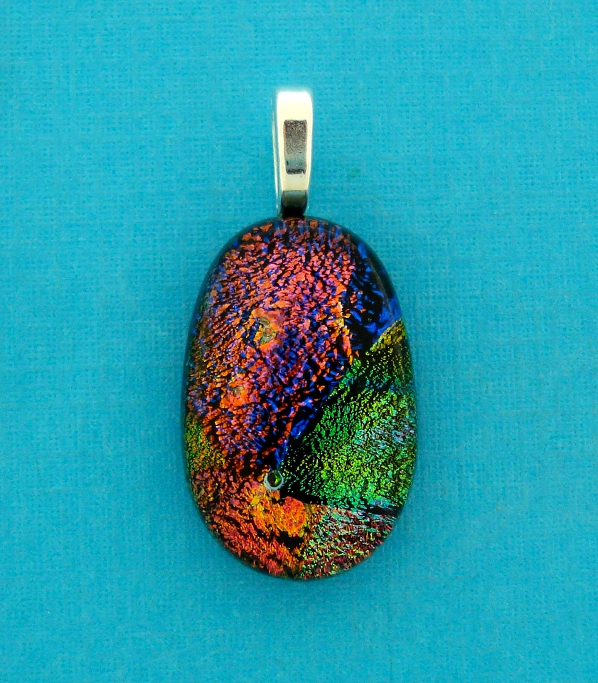 VIDRIO DICROICO OVALADO, SALMÓN, ROJO, VERDE N AZUL, FIANZA PLATEADA Foto 1 de 1