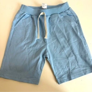 Pantalones cortos deportivos de algodón para niños en azul bebé talla 130/59 (8) - Imagen 1 de 10