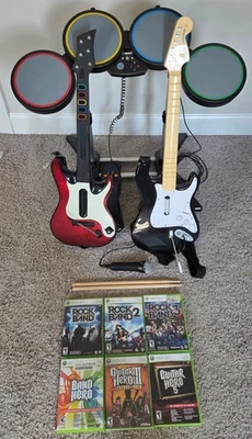 Xbox 360 Rock Band + Guitar Hero Bundle. Mic, Drum Set, 2 Guitars, 6 Games - Image 1 of 4
