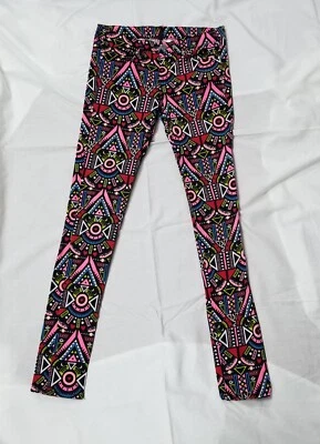 Pantalones ajustados con estampado de festivales tribales multicolores talla 8 EUR 38 Divided by H&M para niñas  Foto 1 de 4