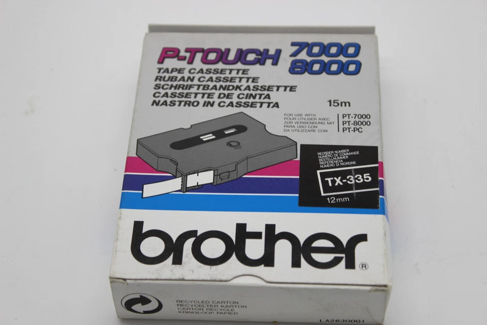Genuine Brother TX-335 - 12mm x 15m Tape, White on Black, NOS - image 1 of 4