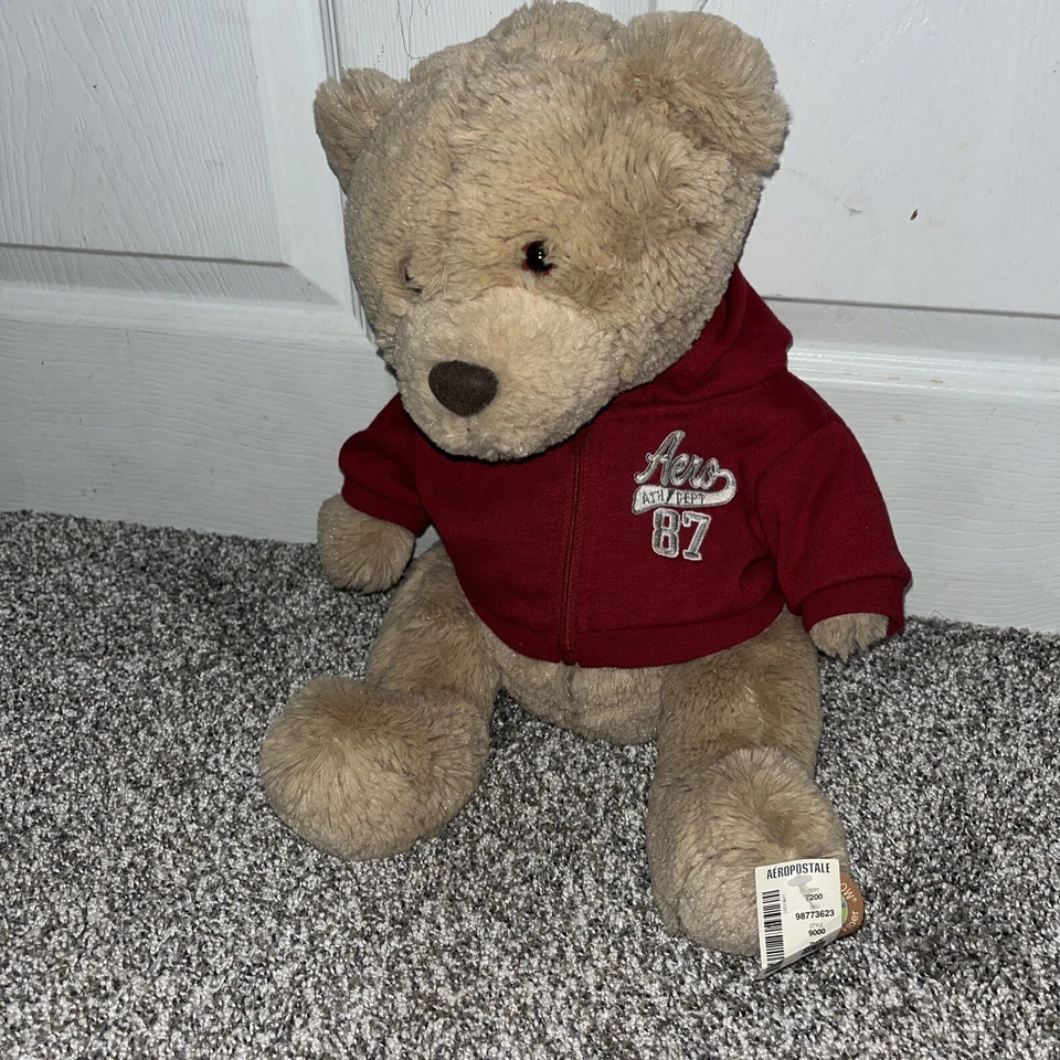 Oso de peluche marrón Aeropostale de peluche con capucha roja con cremallera "Aero 87" 2010 nuevo con etiquetas Foto 1 de 3