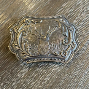 JAMES LIND 1974 Hebilla de cinturón de latón Buck Deer Elk N-13 Wyoming Studio obras de arte - Imagen 1 de 2