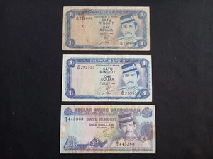 BRUNEI 1 (1976) + 1 (1983 ) + 1 (1991) RINGGIT / DOLLAR Banknotes - Circulated - Picture 1 of 2