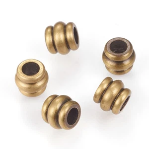 10 piezas Columna de cuentas de latón cepillado lado de protuberancia bronce antiguo 6x5,5 mm orificio: 3 mm - Imagen 1 de 2