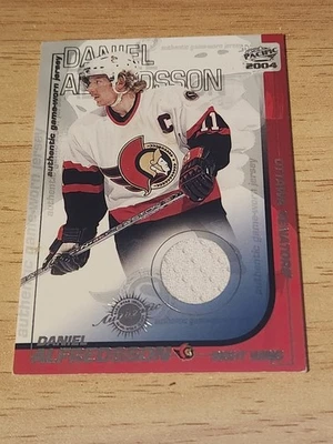 2003-04 Pacific - Authentic Game-Worn Jerseys Daniel Alfredsson #27 Hockey Card - Image 1 of 2