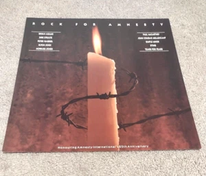 Póster plano promocional Rock for Amnistía Discográfica EX estado RARO 12 X13 - Imagen 1 de 2