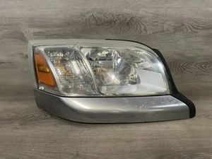 06-09 Mitsubishi Raider Right Passenger Side Halogen Headlight - Picture 1 of 9