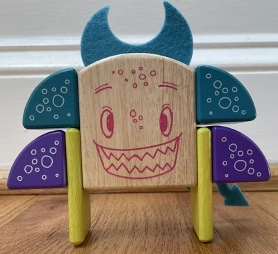 Juego de bloques de madera imán monstruos pegajosos Tegu 8 piezas cara de criatura Foto 1 de 3