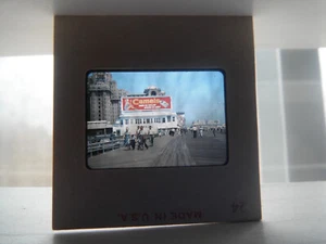 Vintage 35mm Slide Camels Cigarette Billboard Beach Boardwalk Pinup Girl - Picture 1 of 1