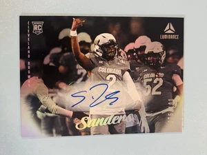 SHEDEUR SANDERS 25 Luminance 🏈 AUTO /100 Buffs, Browns 🔥Rookie - Picture 1 of 2