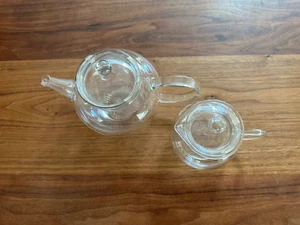 Set of 2 JENAER GLAS Clear Teapot, Lid , Infuser Strainer + and milk/cream jar - Picture 1 of 9